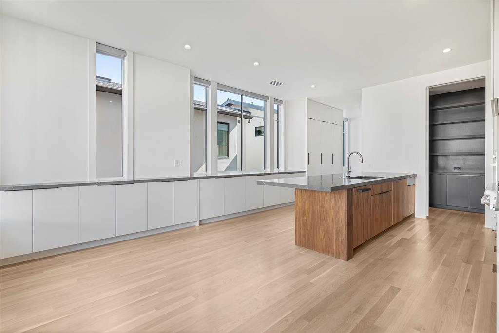 3619 Springbrook Street Dallas, TX 75205 - Photo 17 of 40 a view of a kitchen with furniture and wooden floor