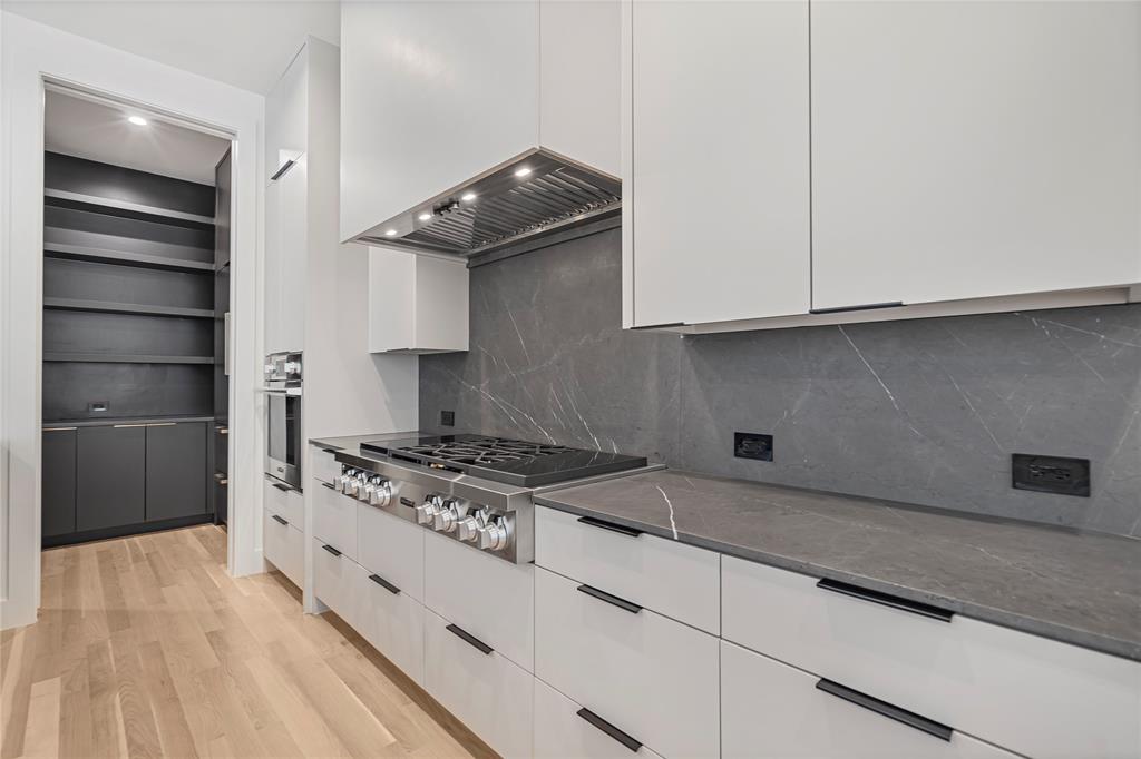 3619 Springbrook Street Dallas, TX 75205 - Photo 19 of 40 a kitchen with granite countertop a stove and a sink