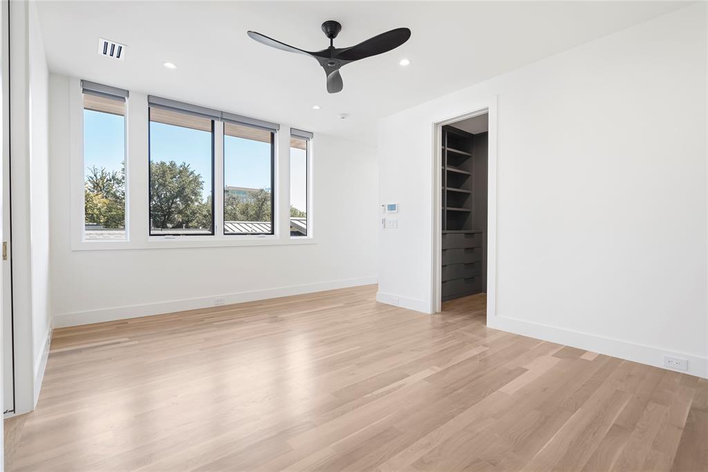 3619 Springbrook Street Dallas, TX 75205 - Photo 19 of 35 a view of empty room with wooden floor and fan