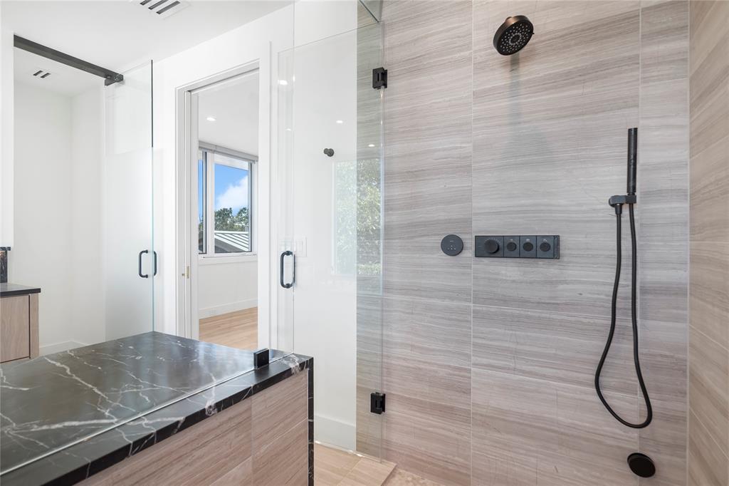3619 Springbrook Street Dallas, TX 75205 - Photo 23 of 35 a bathroom with a granite countertop sink a mirror and shower