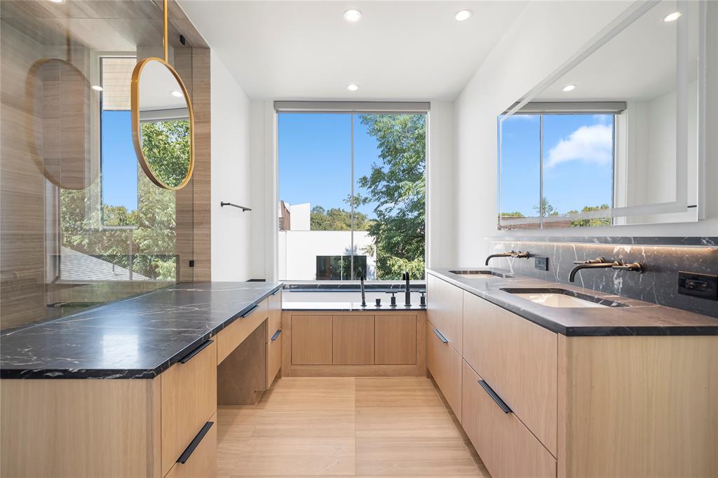 3619 Springbrook Street Dallas, TX 75205 - Photo 25 of 40 a kitchen with stainless steel appliances granite countertop a sink a counter space and a window