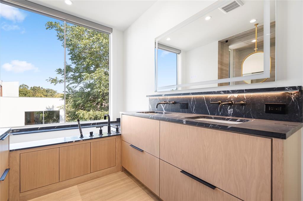 3619 Springbrook Street Dallas, TX 75205 - Photo 26 of 40 a kitchen with stainless steel appliances granite countertop a sink and a wooden cabinets