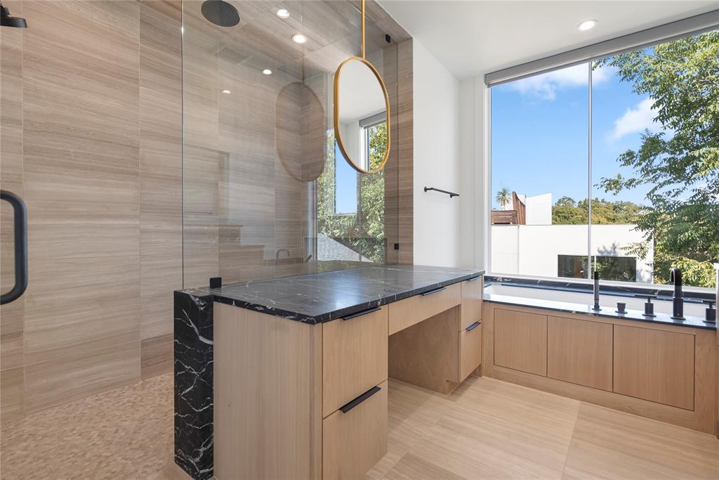 3619 Springbrook Street Dallas, TX 75205 - Photo 27 of 40 a bathroom with a granite countertop sink a mirror and shower