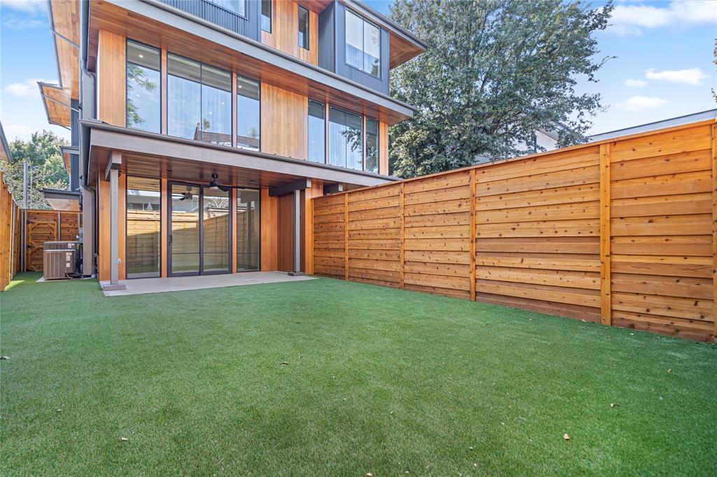 3619 Springbrook Street Dallas, TX 75205 - Photo 31 of 35 a view of a backyard with plants and large trees