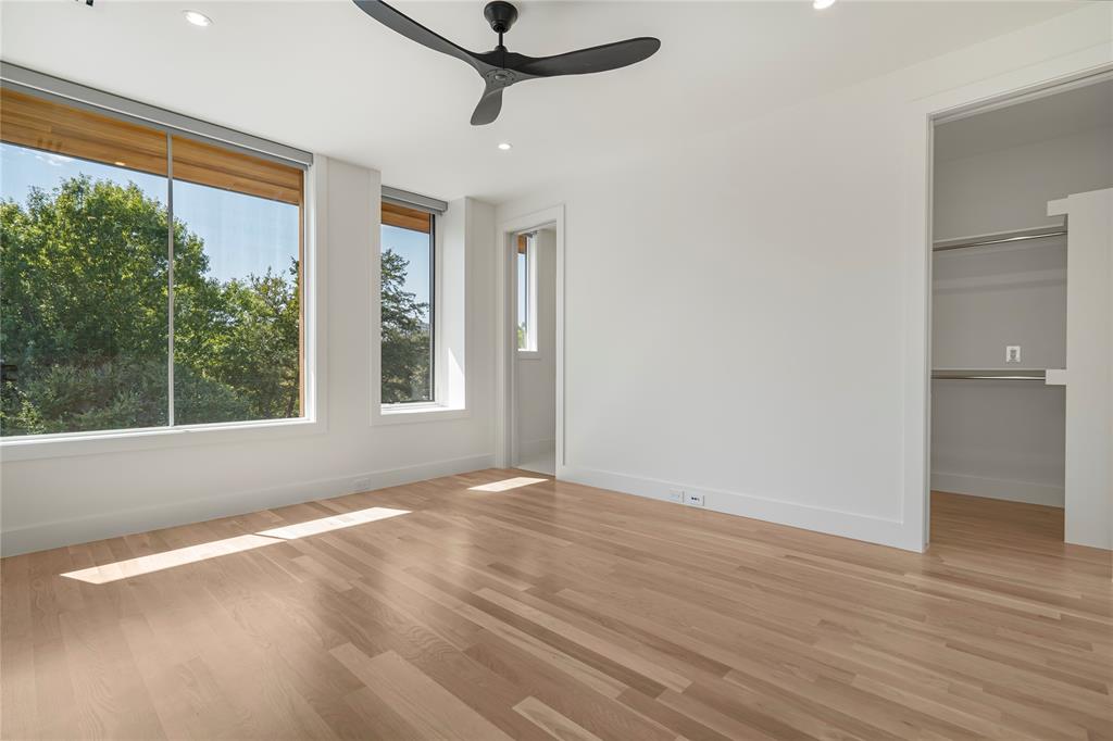 3619 Springbrook Street Dallas, TX 75205 - Photo 33 of 40 a view of an empty room with a window and wooden floor