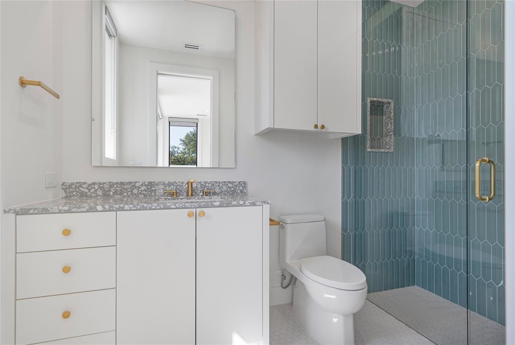 3619 Springbrook Street Dallas, TX 75205 - Photo 34 of 40 a bathroom with a granite countertop toilet sink and mirror