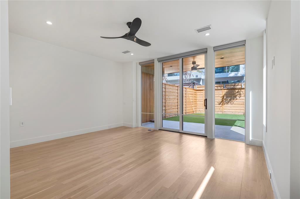 3619 Springbrook Street Dallas, TX 75205 - Photo 5 of 35 a view of empty room with wooden floor and fan