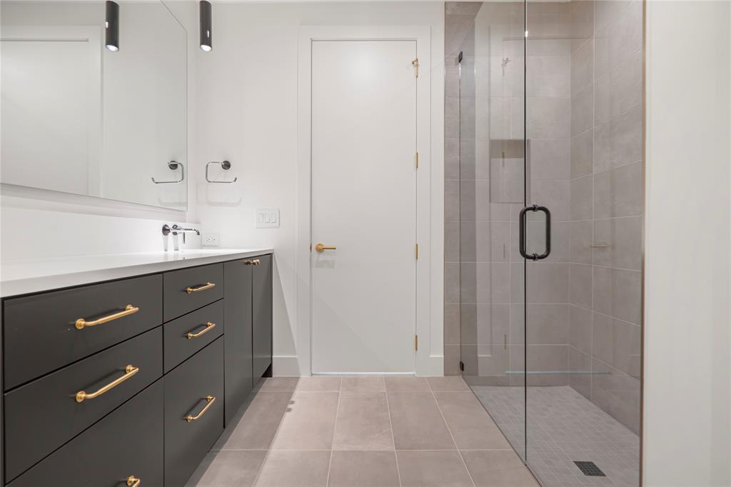 3619 Springbrook Street Dallas, TX 75205 - Photo 8 of 40 a bathroom with a granite countertop sink a mirror and shower