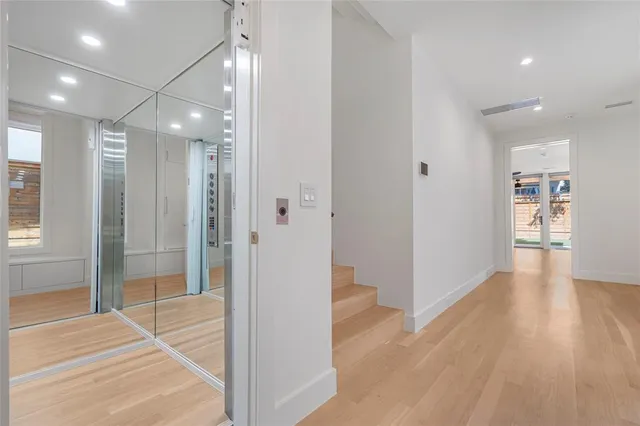 an empty room with windows and yard