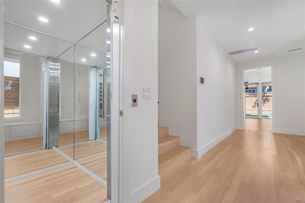 3619 Springbrook Street Dallas, TX 75205 - Photo 8 of 35 a view of a hallway with wooden floor