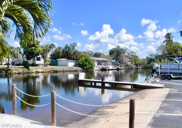 33 Henderson Drive Naples, FL 34114 - Photo 13 of 15 a water view with boat and palm trees