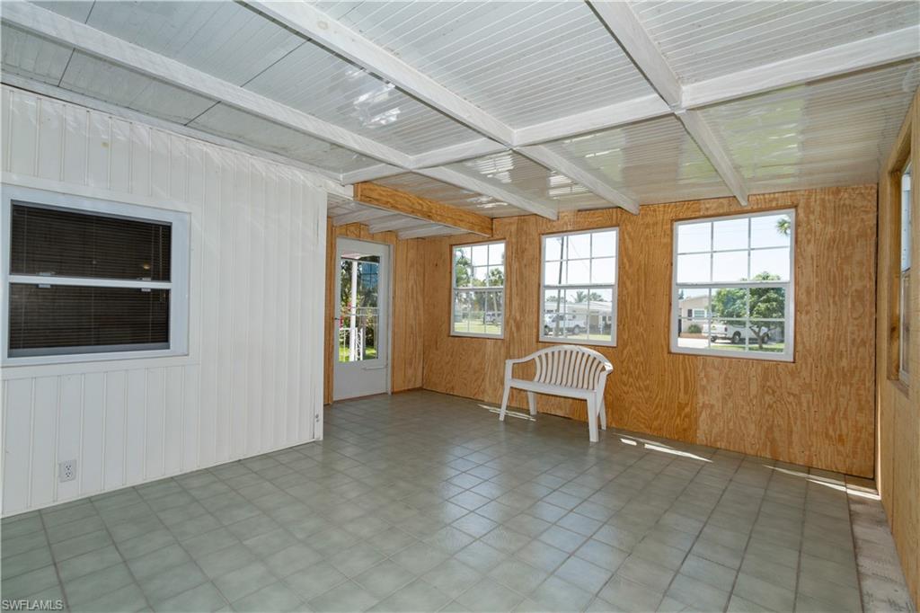 33 Henderson Drive Naples, FL 34114 - Photo 6 of 15 a view of a livingroom with furniture and windows
