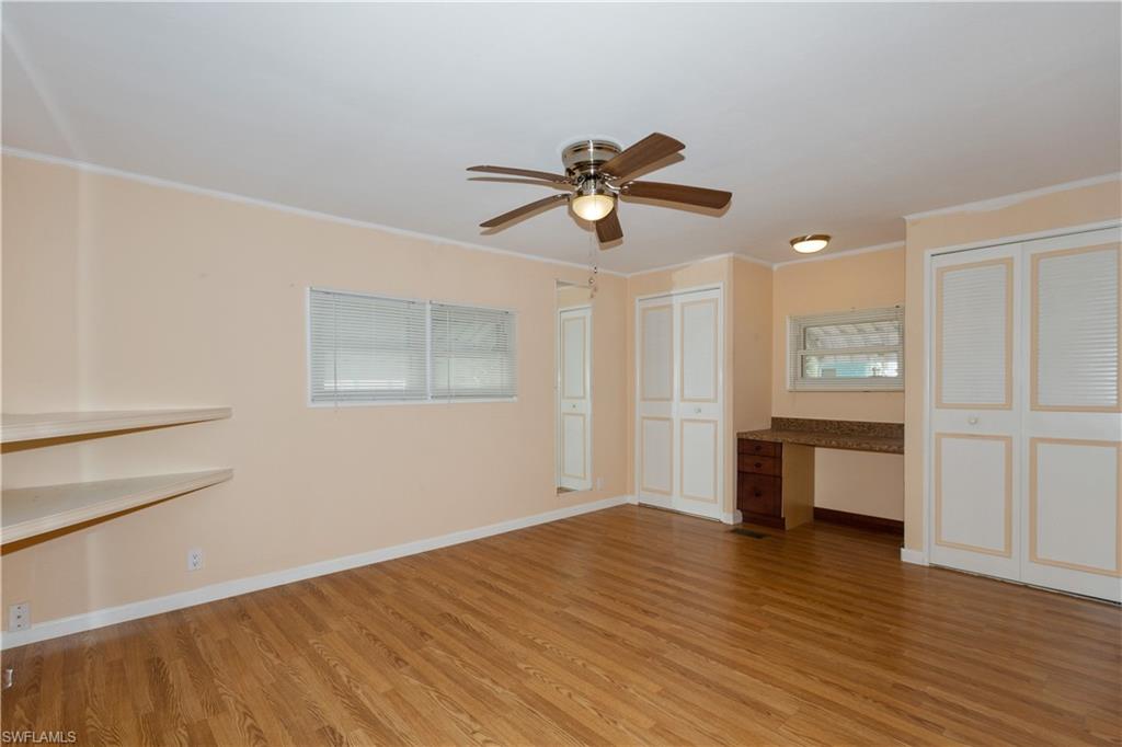 33 Henderson Drive Naples, FL 34114 - Photo 7 of 15 a view of empty room with wooden floor and fan