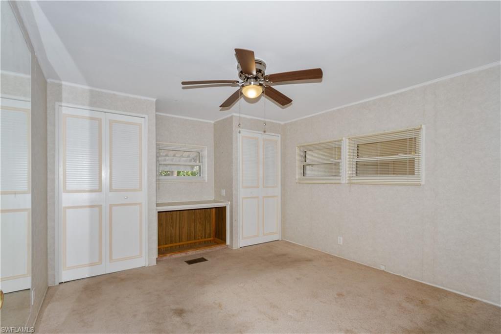 33 Henderson Drive Naples, FL 34114 - Photo 8 of 15 a view of empty room with ceiling fan