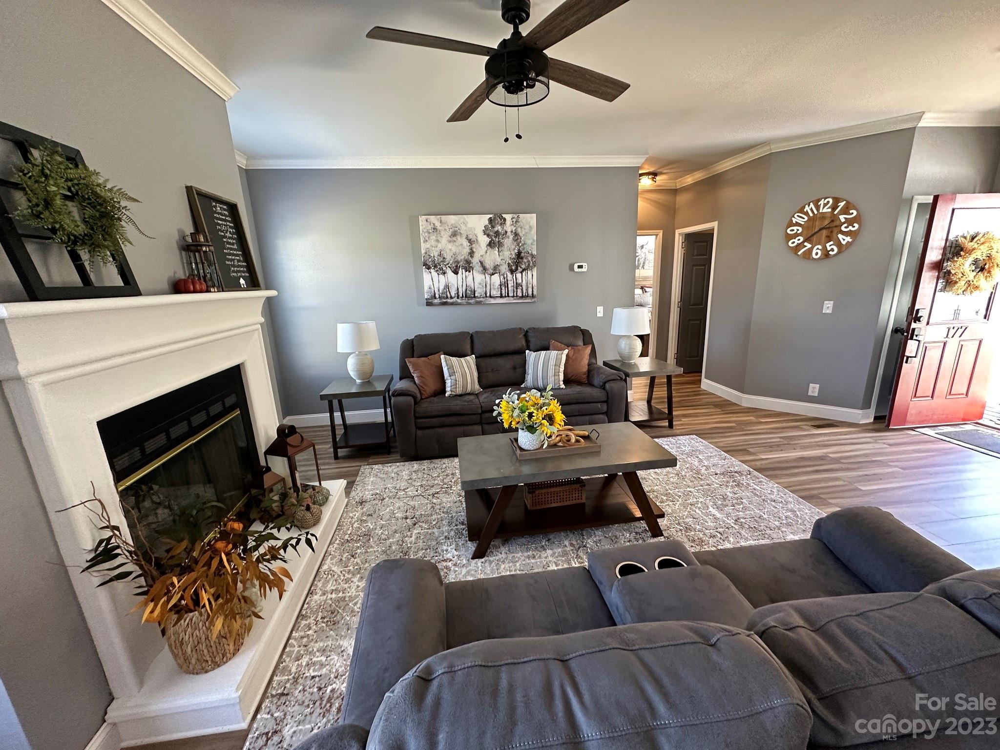 177 Potter's Road Woodleaf, NC 27054 - Photo 6 of 30 a living room with furniture and a fireplace