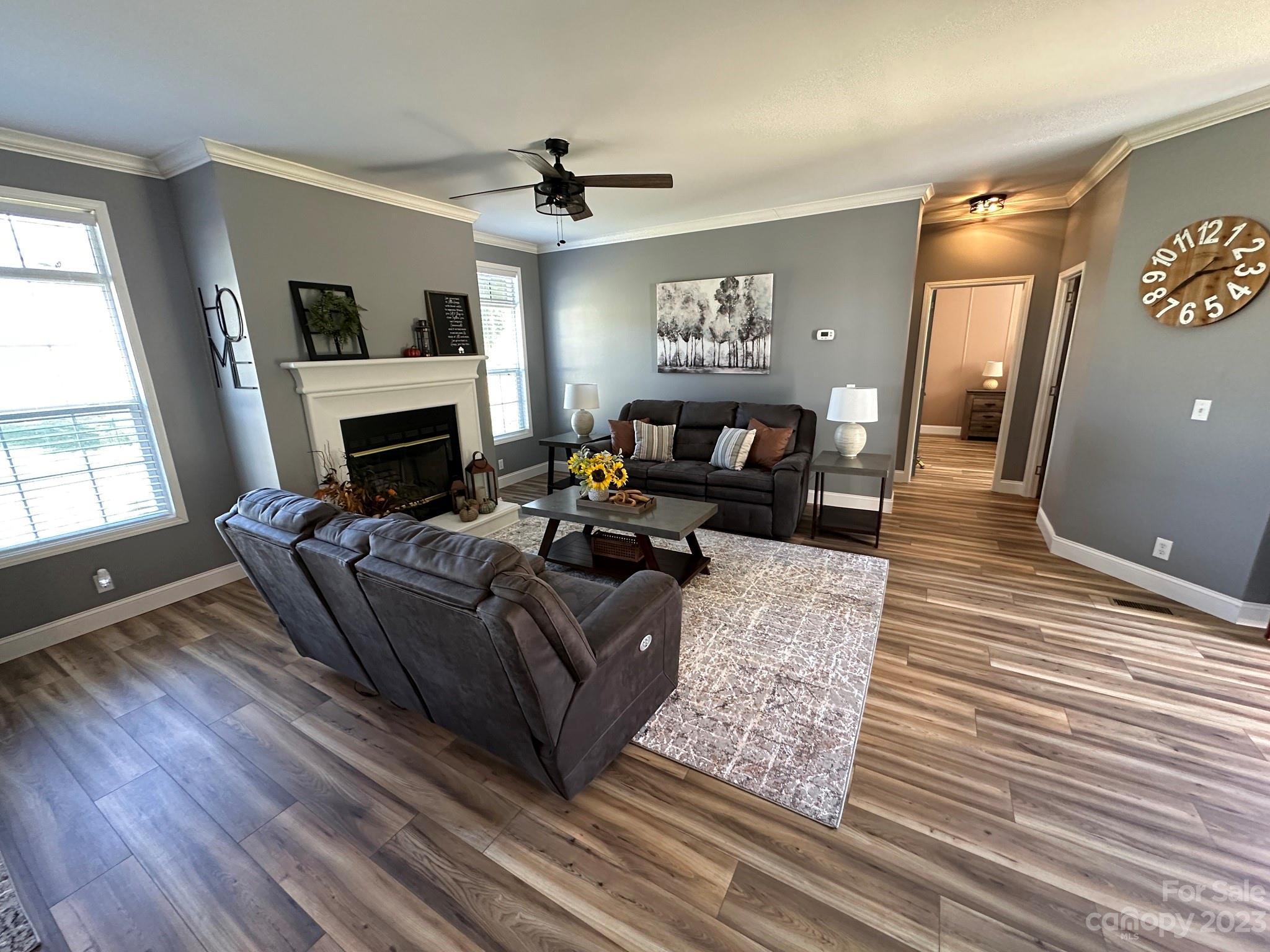 177 Potter's Road Woodleaf, NC 27054 - Photo 8 of 30 a living room with furniture and a fireplace