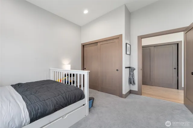 a living room with furniture rug and a table