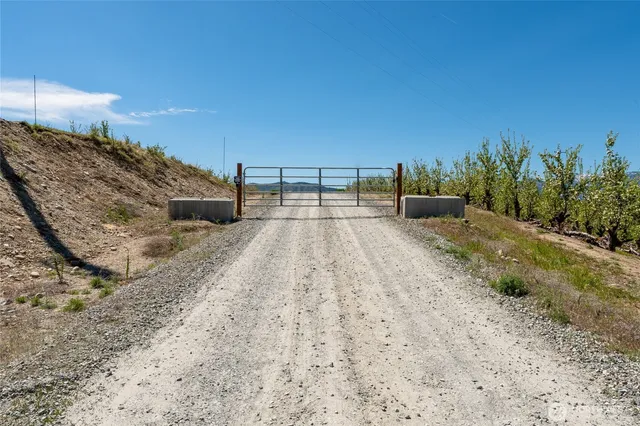 a view of a swimming pool with a table and chairs