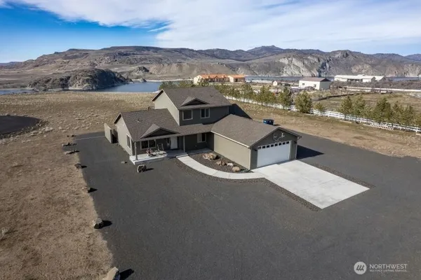 an aerial view of a house with a lake view