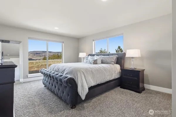 a bed room with a bed and a window
