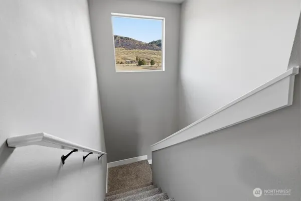 a view of a hallway with stairs