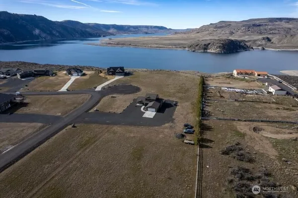 an aerial view of a house with mountain view