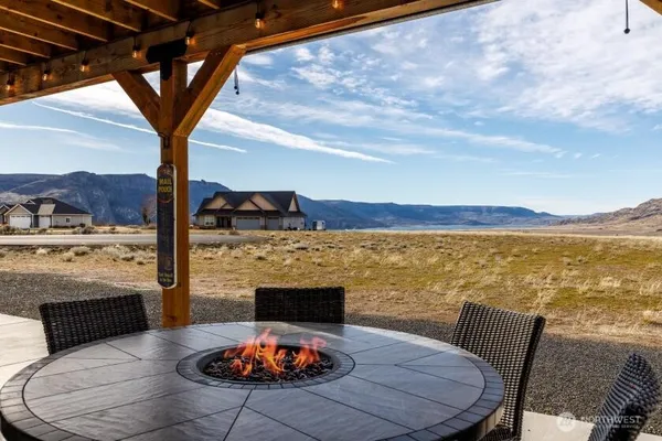 a outdoor view with a sitting space garden and swimming pool