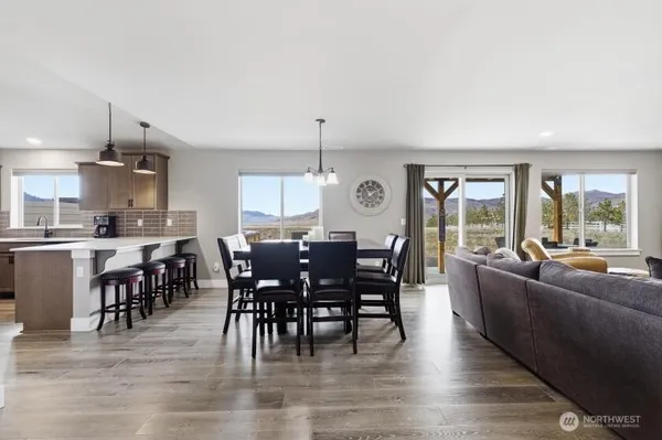 a view of a dining room with furniture window and wooden floor