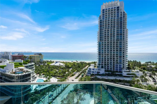 a view of a balcony with two chairs and a table
