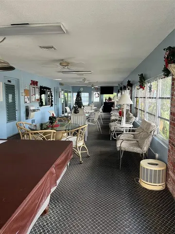 a room with gym equipment and windows