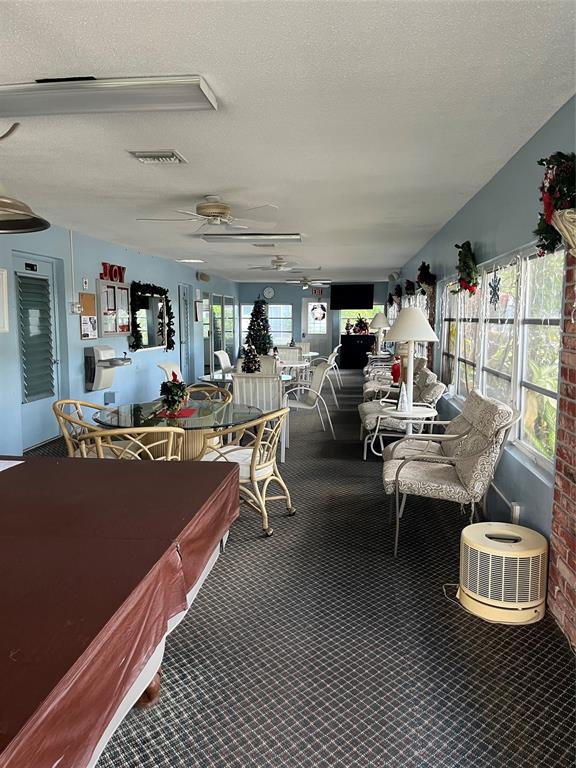 2050 Northeast 39th Street, Unit 312E Lighthouse Point, FL 33064 - Photo 14 of 17 a living room with lots of furniture and white walls