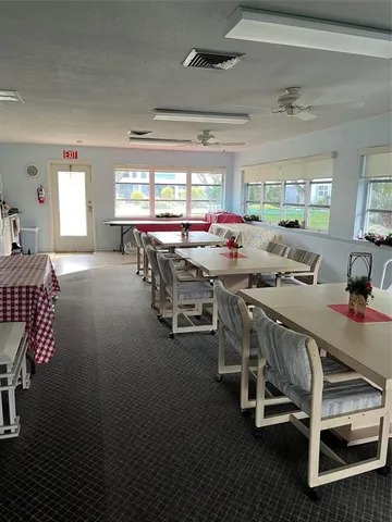 a living room with lots of furniture and a rug