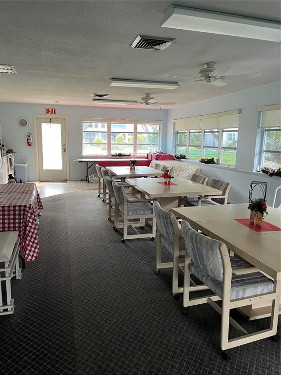 2050 Northeast 39th Street, Unit 312E Lighthouse Point, FL 33064 - Photo 16 of 17 a view of a dining room with furniture window and outside view