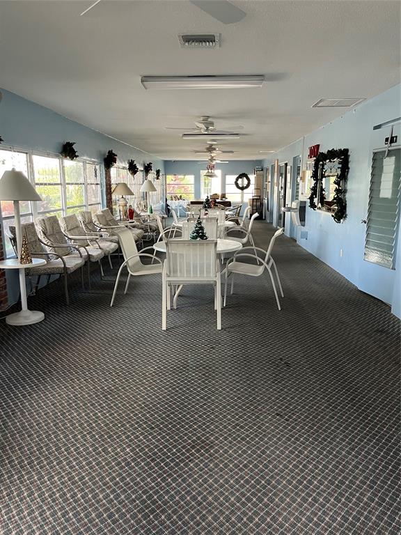 2050 Northeast 39th Street, Unit 312E Lighthouse Point, FL 33064 - Photo 17 of 17 a living room with lots of furniture and a rug