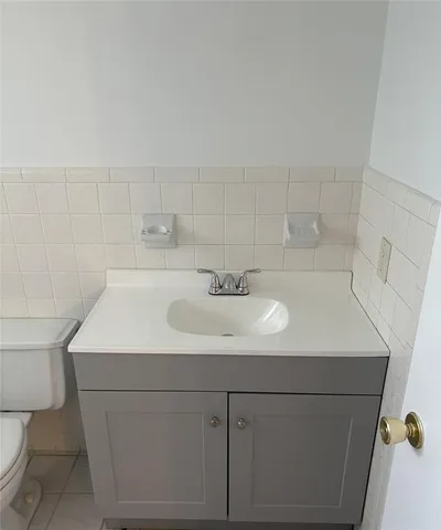 a view of an empty room and a window