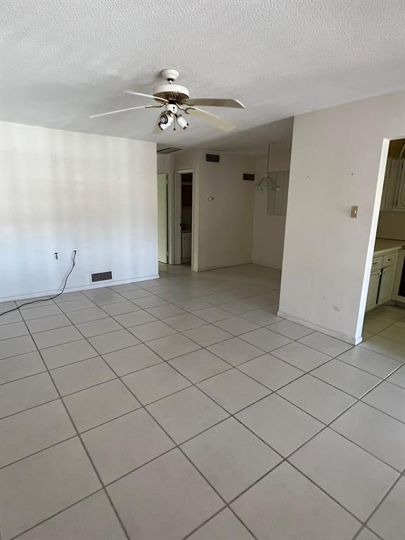 2050 Northeast 39th Street, Unit 312E Lighthouse Point, FL 33064 - Photo 2 of 17 a view of an empty room and chandelier fan