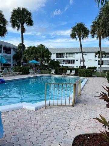 a view of a swimming pool with a patio
