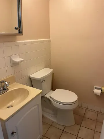 a bathroom with a toilet and a sink