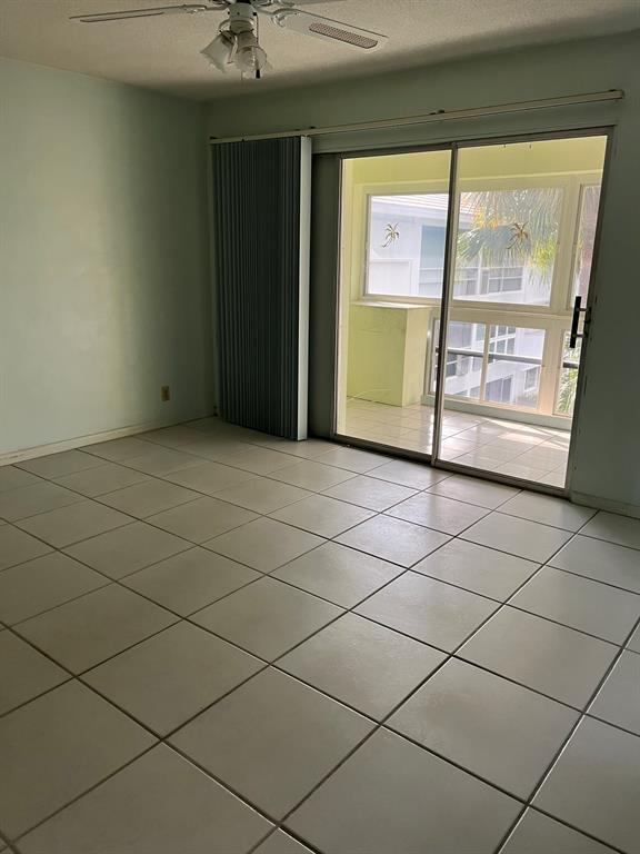 2050 Northeast 39th Street, Unit 312E Lighthouse Point, FL 33064 - Photo 6 of 17 a view of an empty room and a window