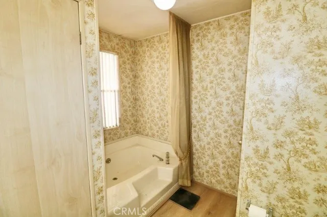 a bathroom with a bathtub and shower