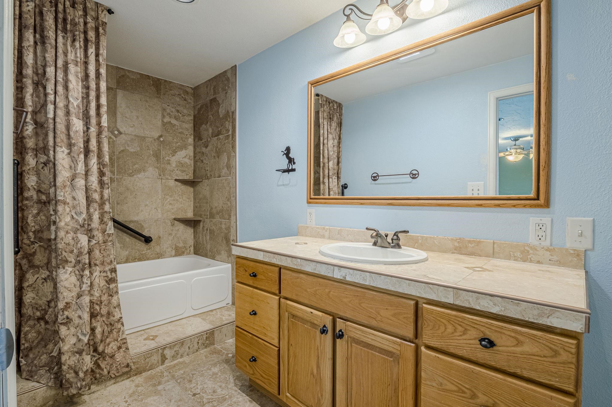 585-29 29 3/8 Road Grand Junction, CO 81504 - Photo 17 of 42 a bathroom with a sink a toilet and shower