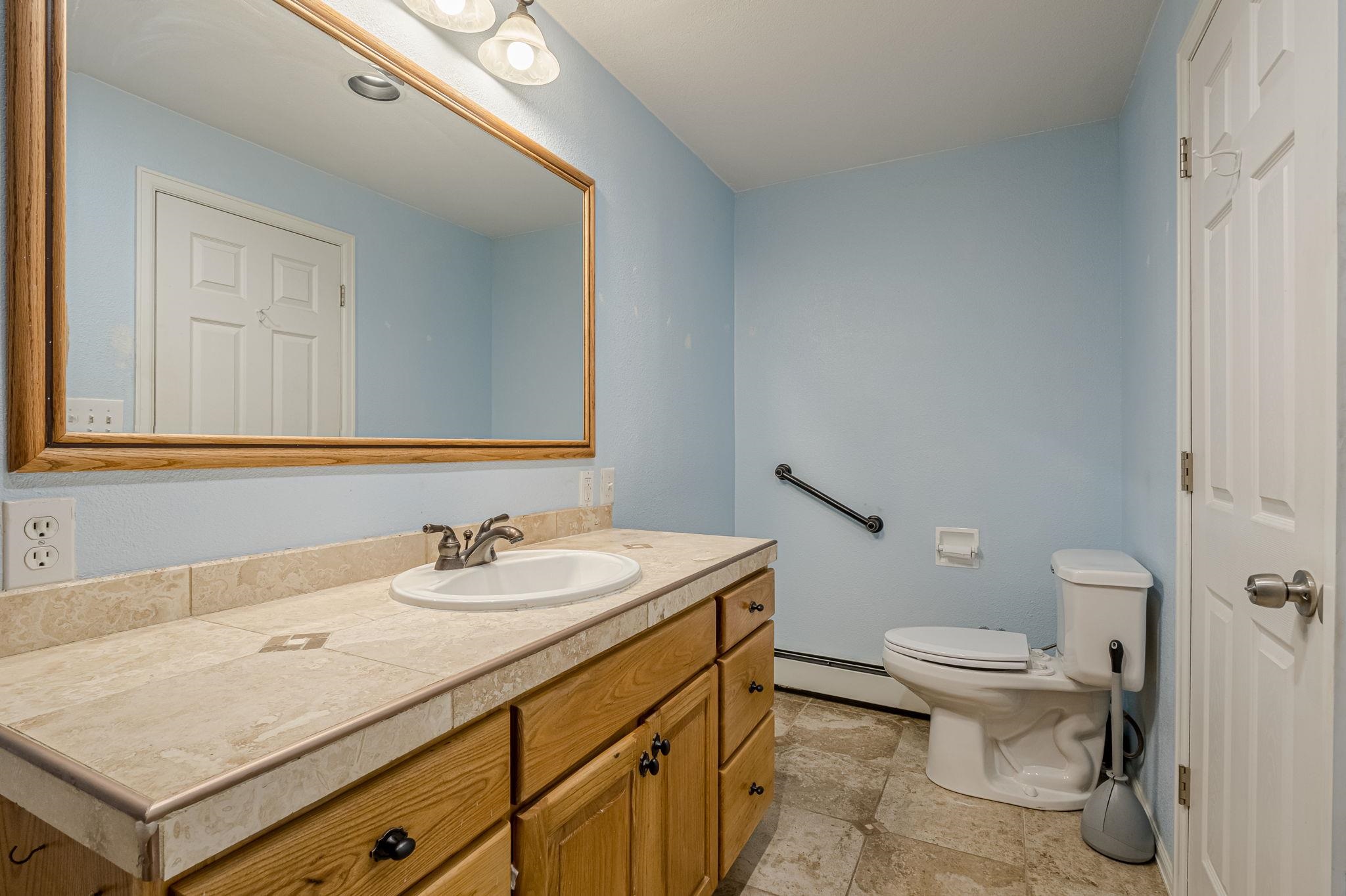 585-29 29 3/8 Road Grand Junction, CO 81504 - Photo 19 of 42 a bathroom with a sink toilet and a mirror