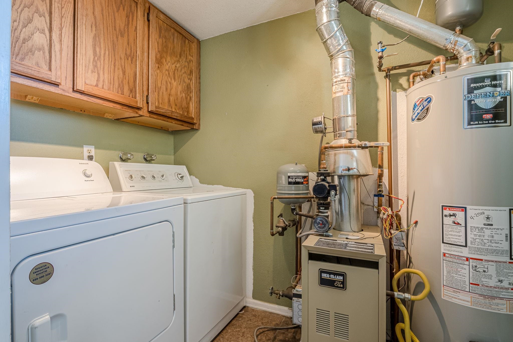 585-29 29 3/8 Road Grand Junction, CO 81504 - Photo 29 of 42 a view of storage and utility room with washer and dryer
