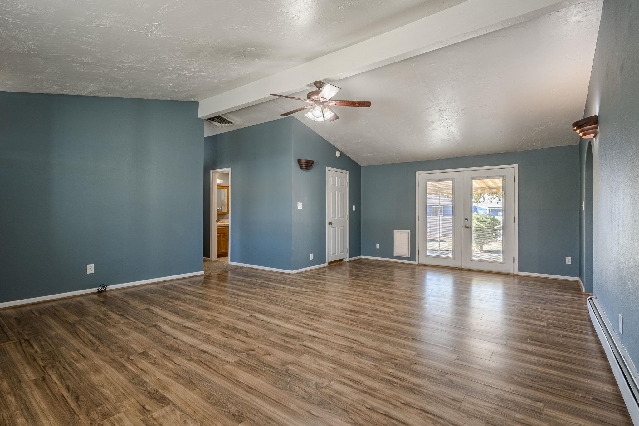 585-29 29 3/8 Road Grand Junction, CO 81504 - Photo 3 of 42 a view of empty room with wooden floor and fan