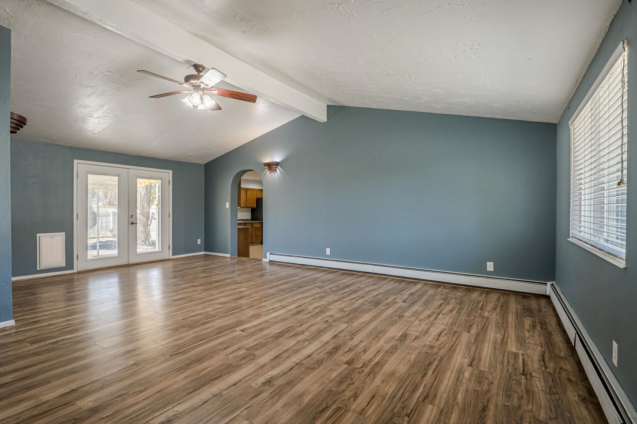 585-29 29 3/8 Road Grand Junction, CO 81504 - Photo 4 of 42 a view of an empty room with wooden floor and window