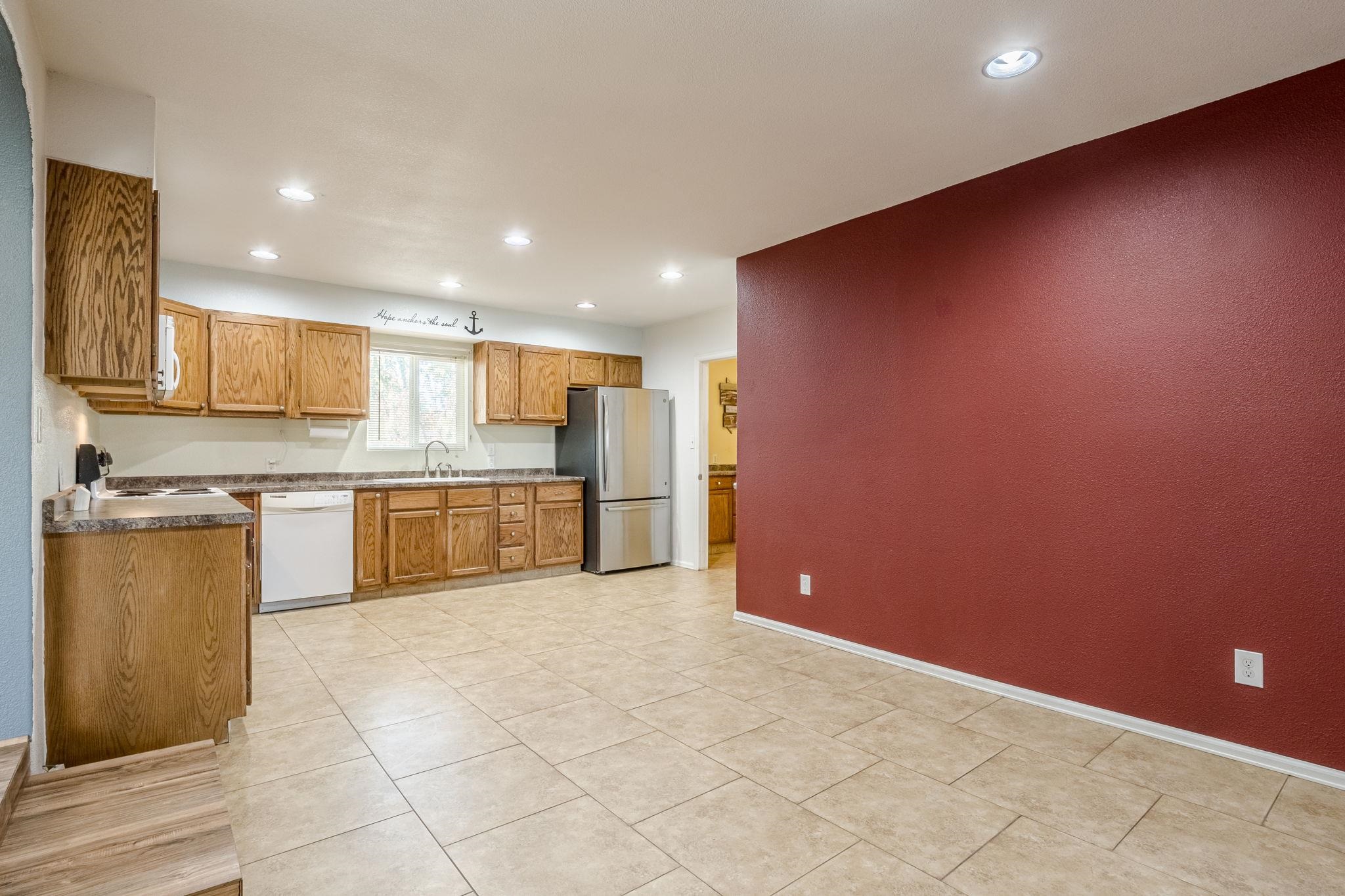 585-29 29 3/8 Road Grand Junction, CO 81504 - Photo 8 of 42 a large kitchen with a stove a sink cabinets and a refrigerator