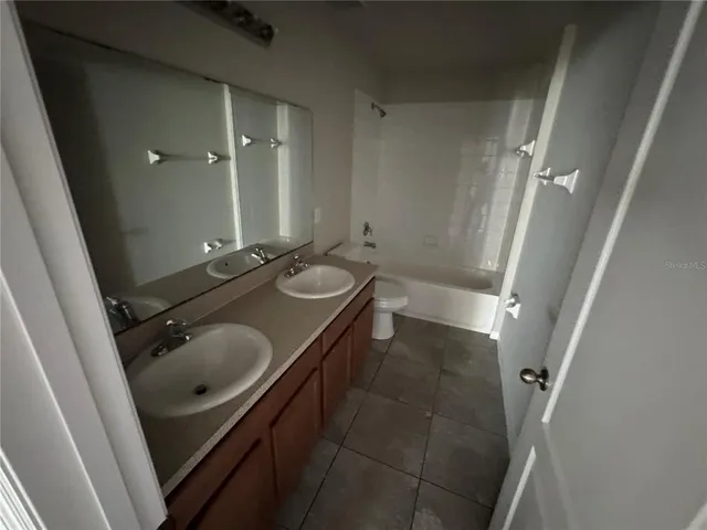 an empty room with a empty space and windows