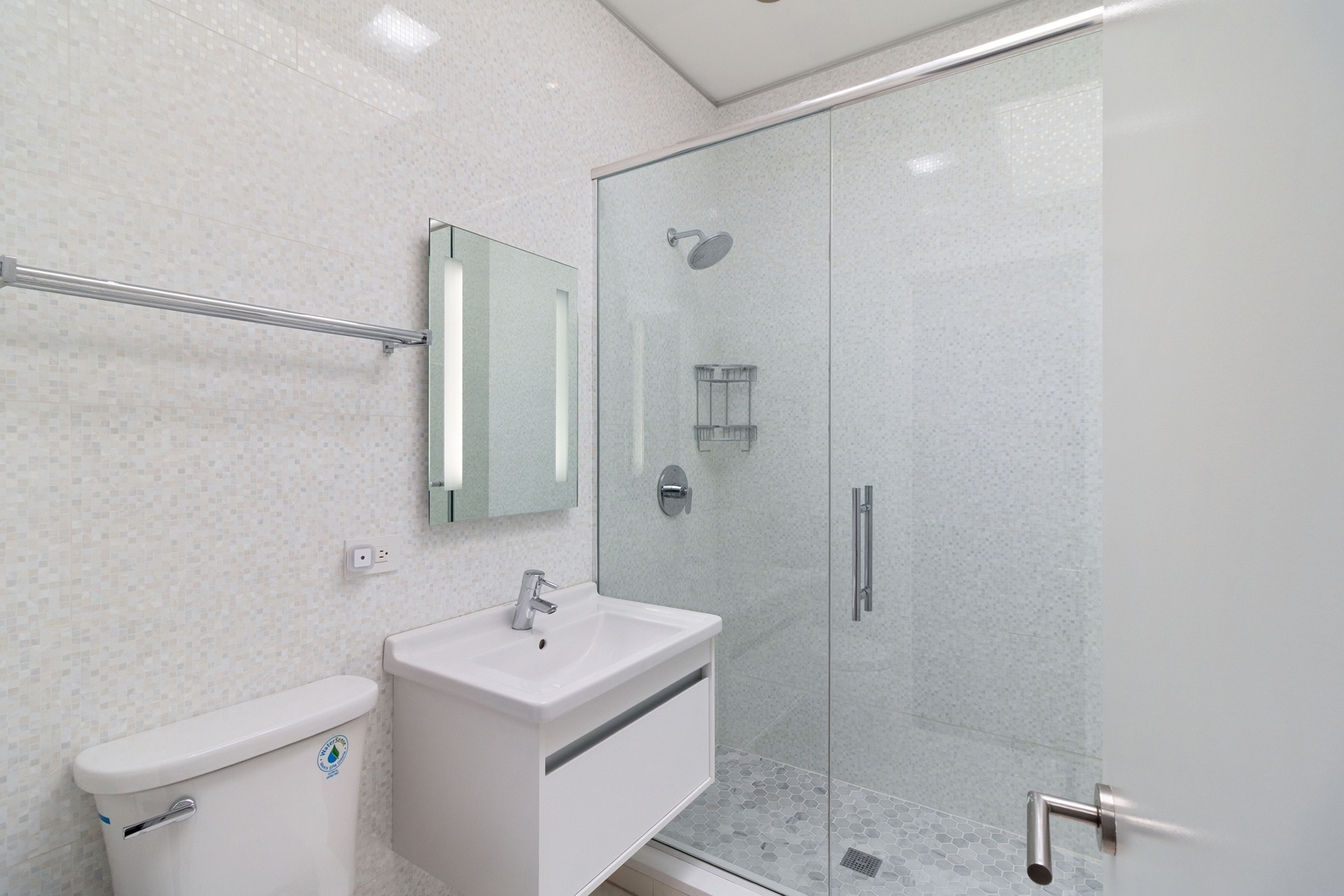 Undisclosed Address Chicago, IL 60607 - Photo 16 of 17 a bathroom with a sink a toilet and shower