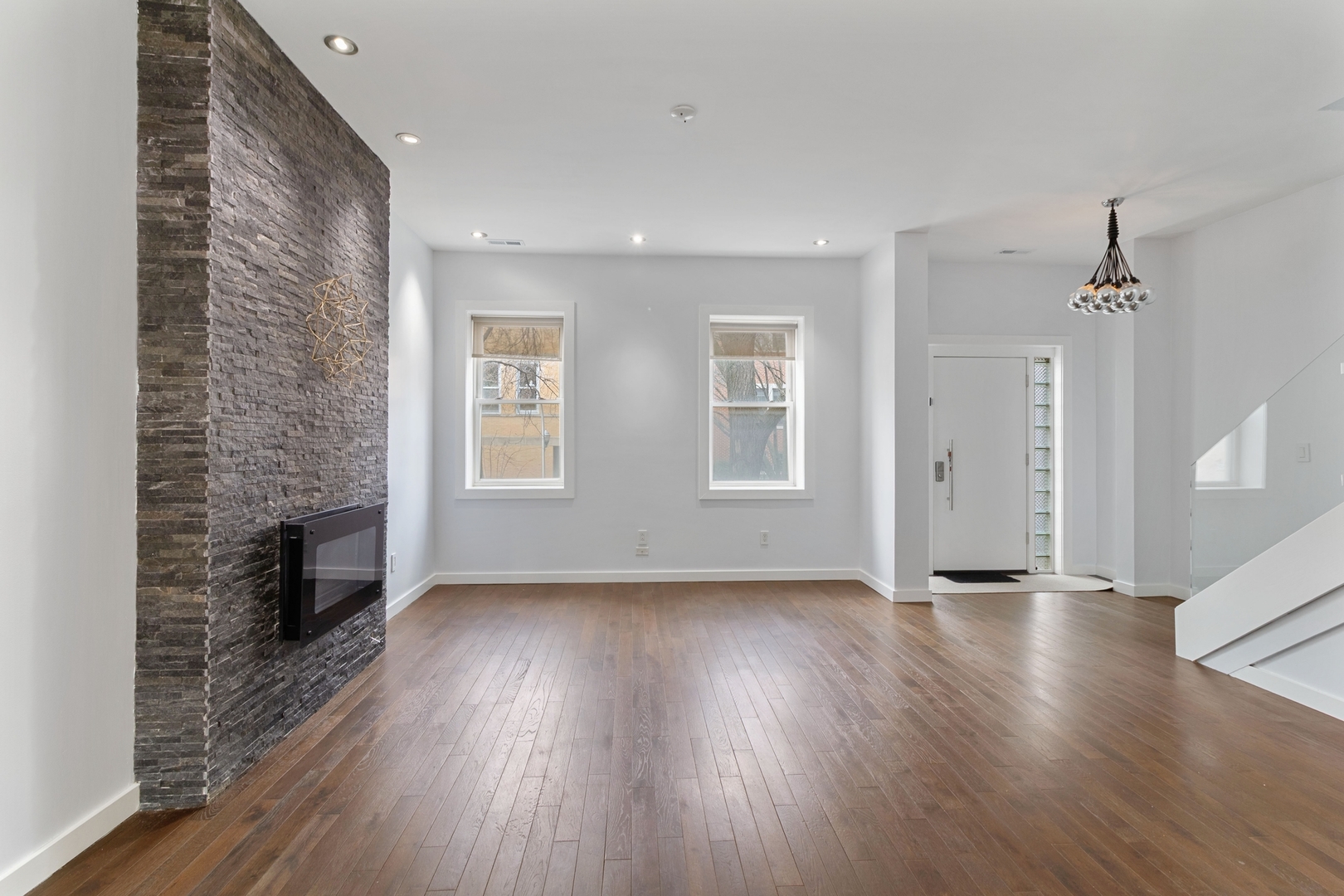 Undisclosed Address Chicago, IL 60607 - Photo 5 of 17 a view of an empty room with wooden floor and a window