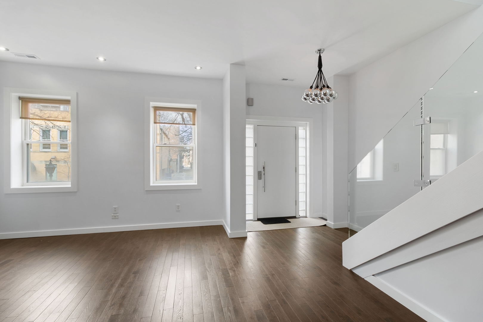 Undisclosed Address Chicago, IL 60607 - Photo 6 of 17 an empty room with wooden floor and windows